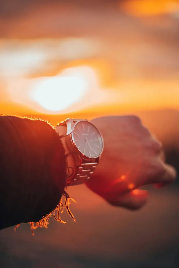 round silver-colored analog watch with link bracelet